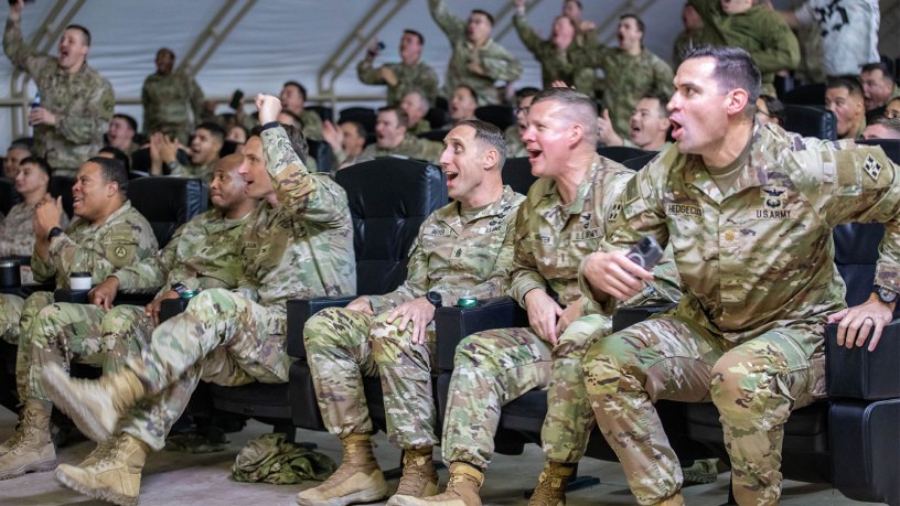 Soldiers celebrate the announcement that Kuwait is now a deployment again.